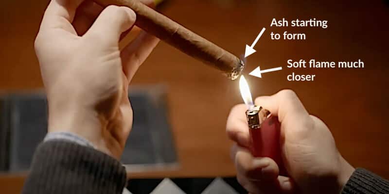 soft flame evenly lighting cigar