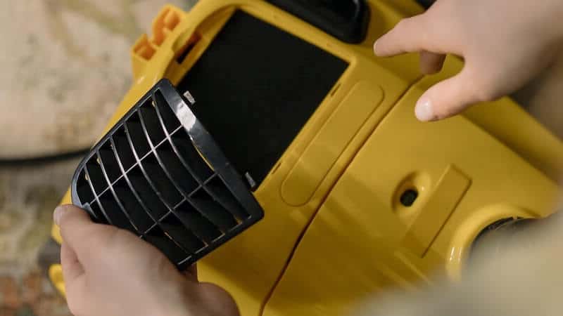 vacuum cleaner being maintained