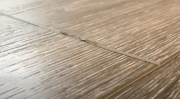 how to fix laminate that is lifting